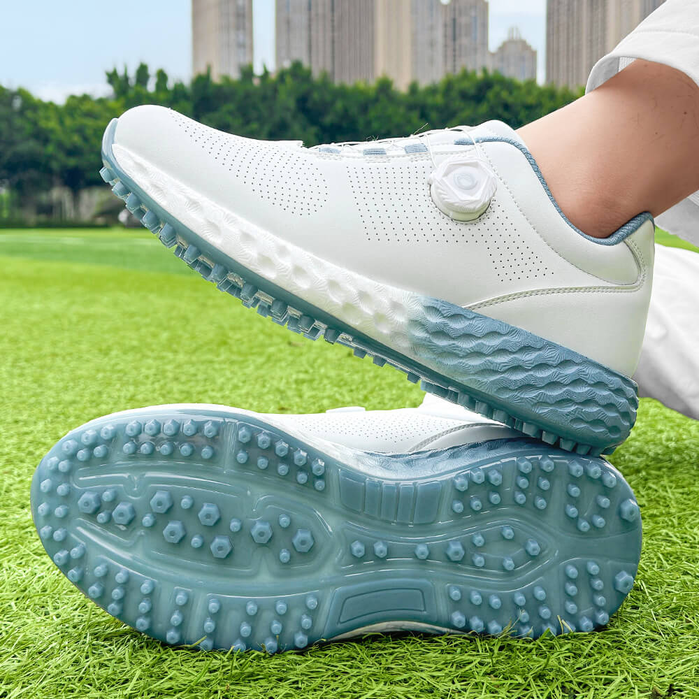 man wearing golf shoes on the grass blue outsole 1
