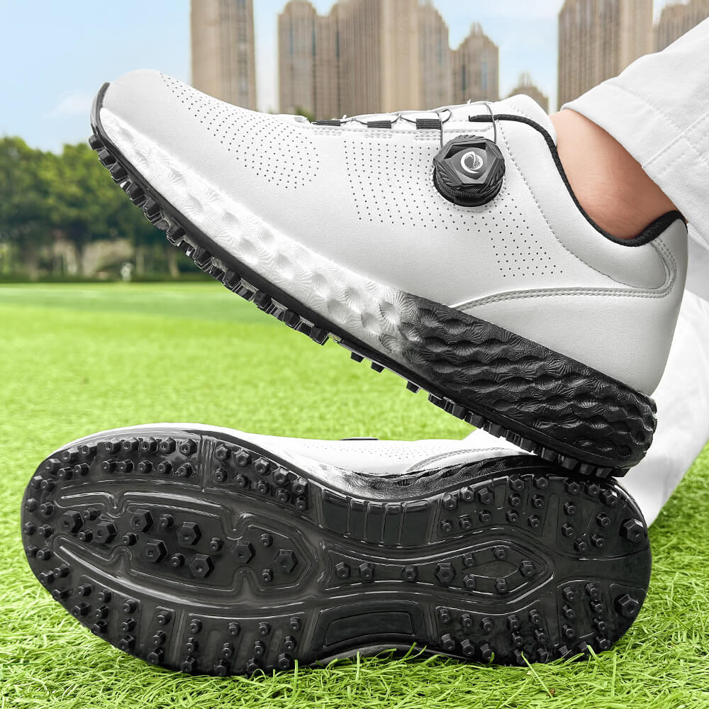 man wearing golf shoes on the grass black outsole 1