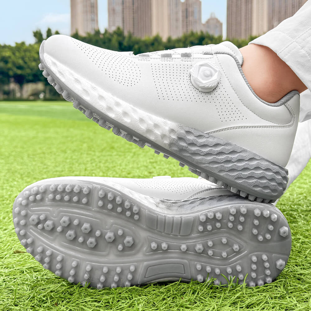 man wearing golf shoes on the grass gray outsole 1