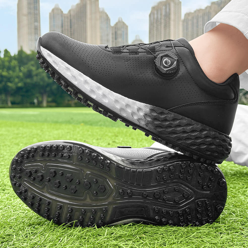 man wearing black golf shoes on the grass
