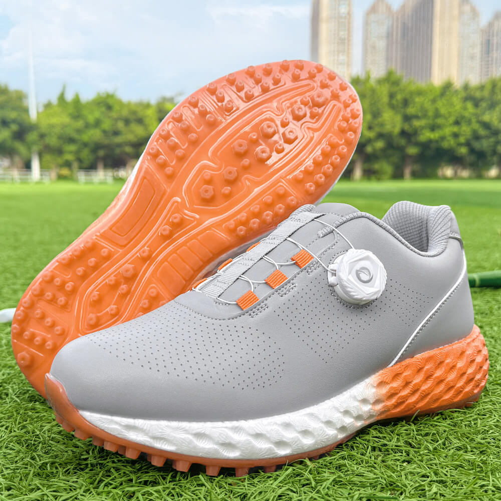 golf shoes on green grass course orange outsole
