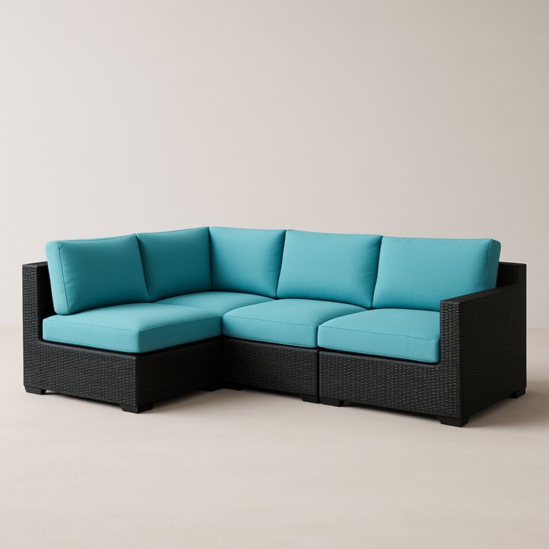 Divano angolare in rattan sintetico nero con cuscini blu