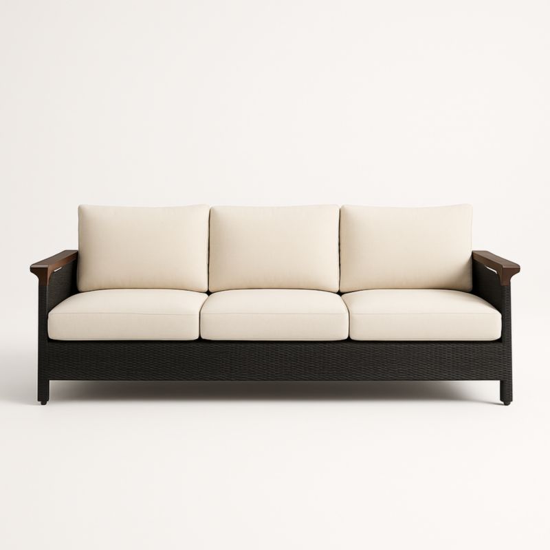 Divano tre posti in rattan con cuscini in tessuto beige