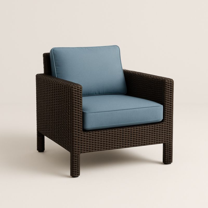 Poltrona in Rattan Marrone con Cuscini Azzurri