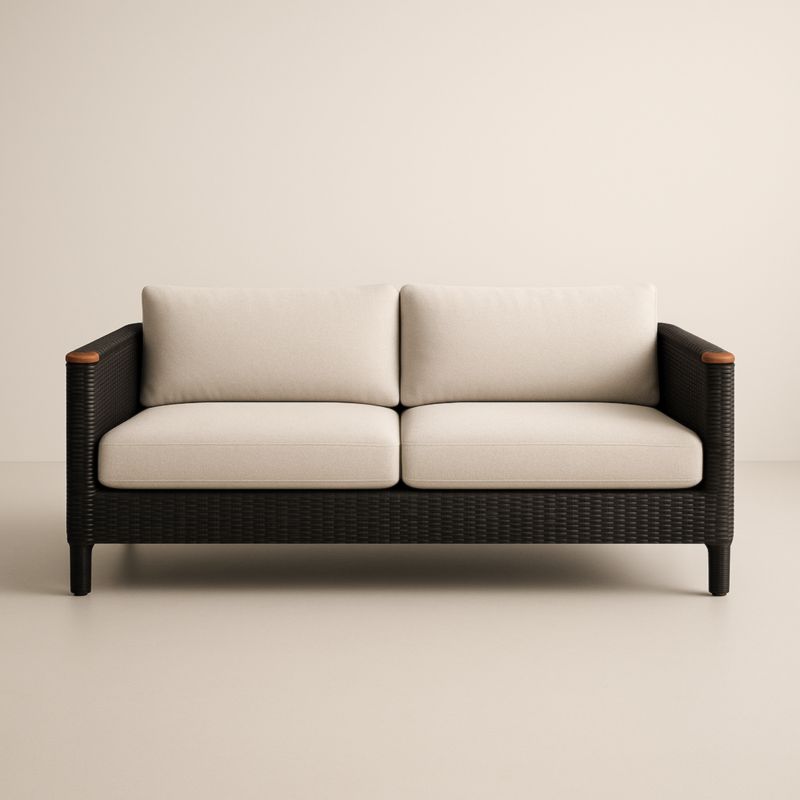 Divano in rattan nero con cuscini in poliestere beige