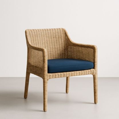 Fauteuil en rotin synthétique avec coussin bleu