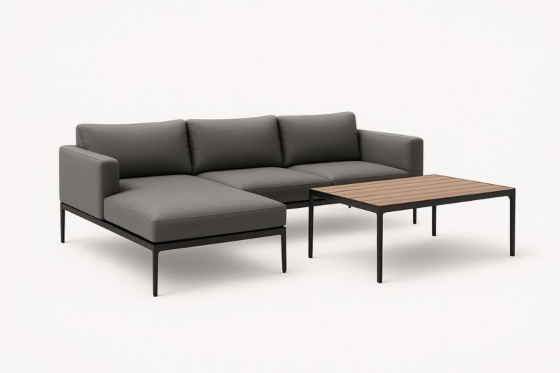 Divano angolare in tessuto grigio con struttura in metallo e tavolino in legno