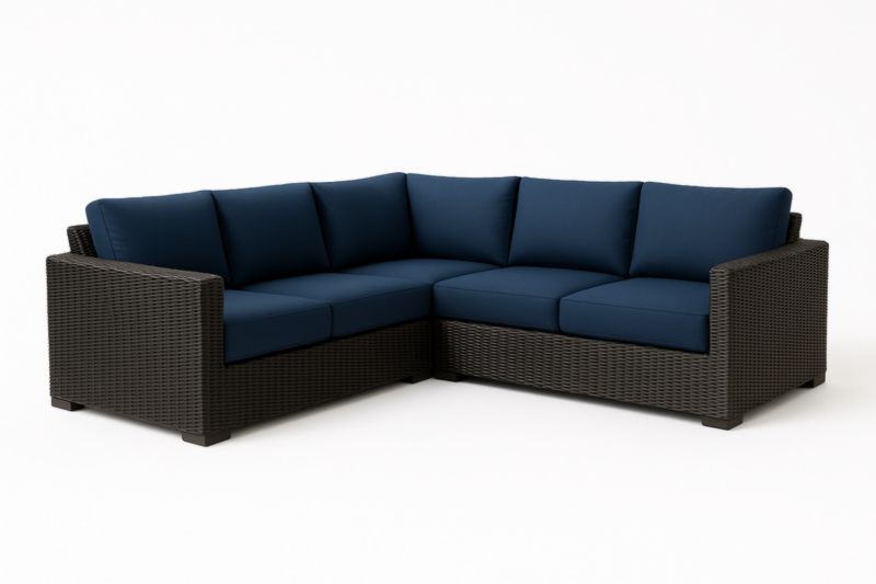 Divano angolare in rattan sintetico con cuscini blu