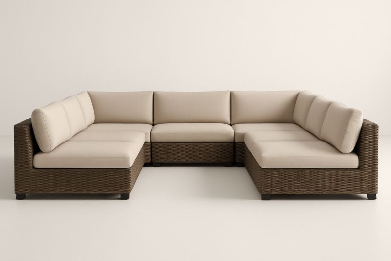 Divano angolare da esterno in polyrattan marrone con cuscini in tessuto beige
