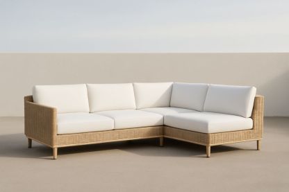 Divano angolare in rattan sintetico con cuscini bianchi