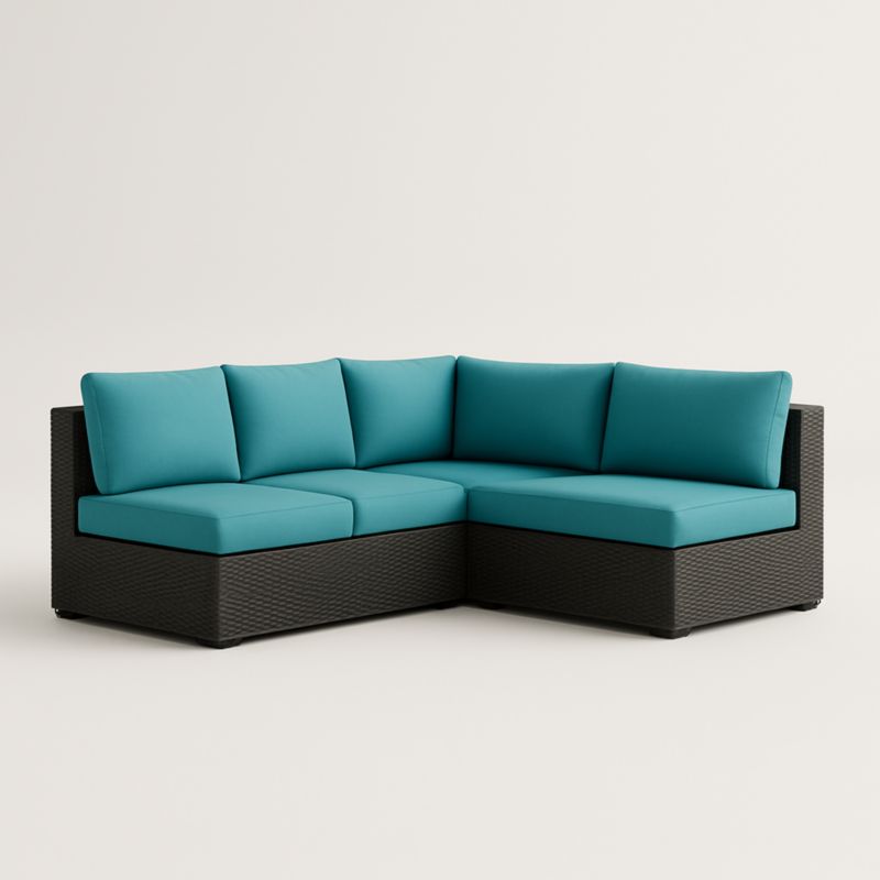 Divano angolare in rattan sintetico con cuscini blu turchese