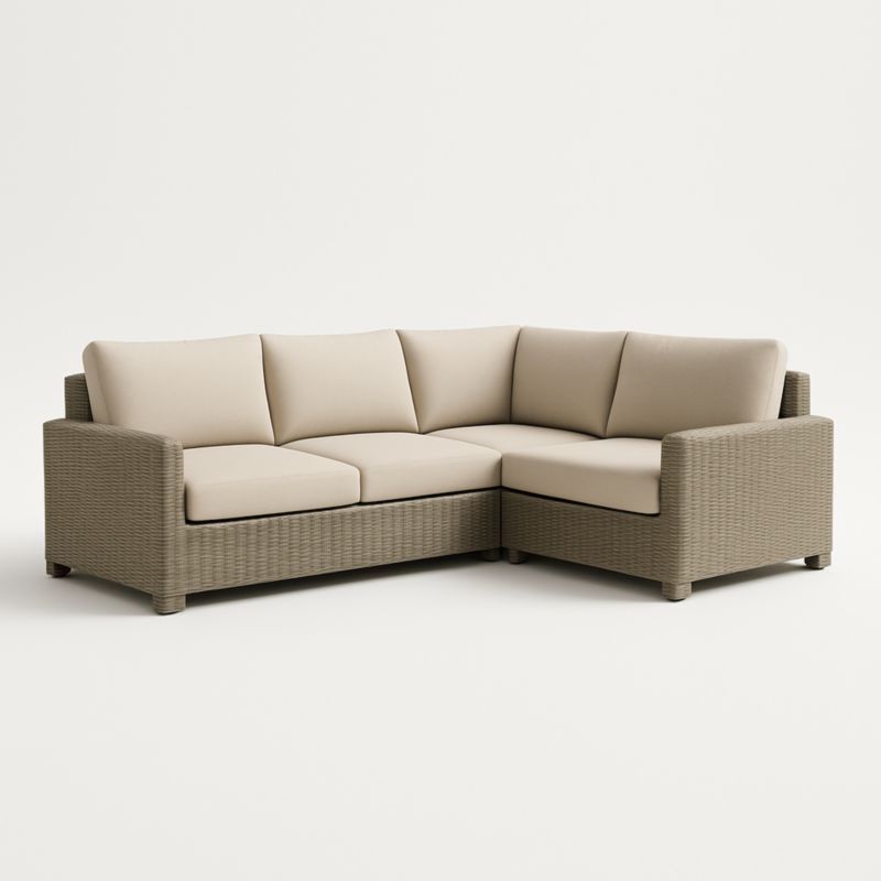 Divano angolare in vimini sintetico con cuscini in tessuto acrilico