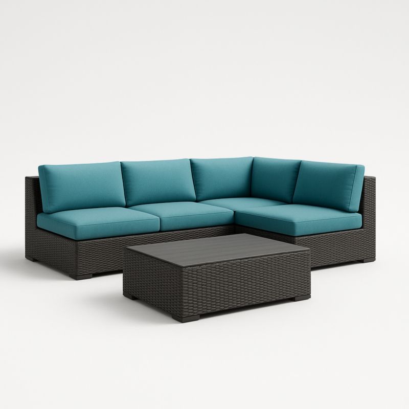 Divano angolare in rattan con cuscini turchesi