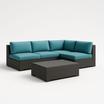 Divano angolare in rattan con cuscini turchesi