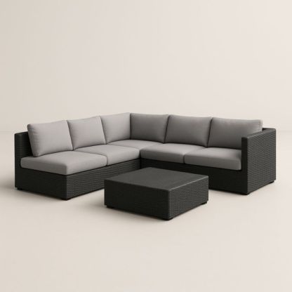 Divano angolare in rattan sintetico con cuscini grigi