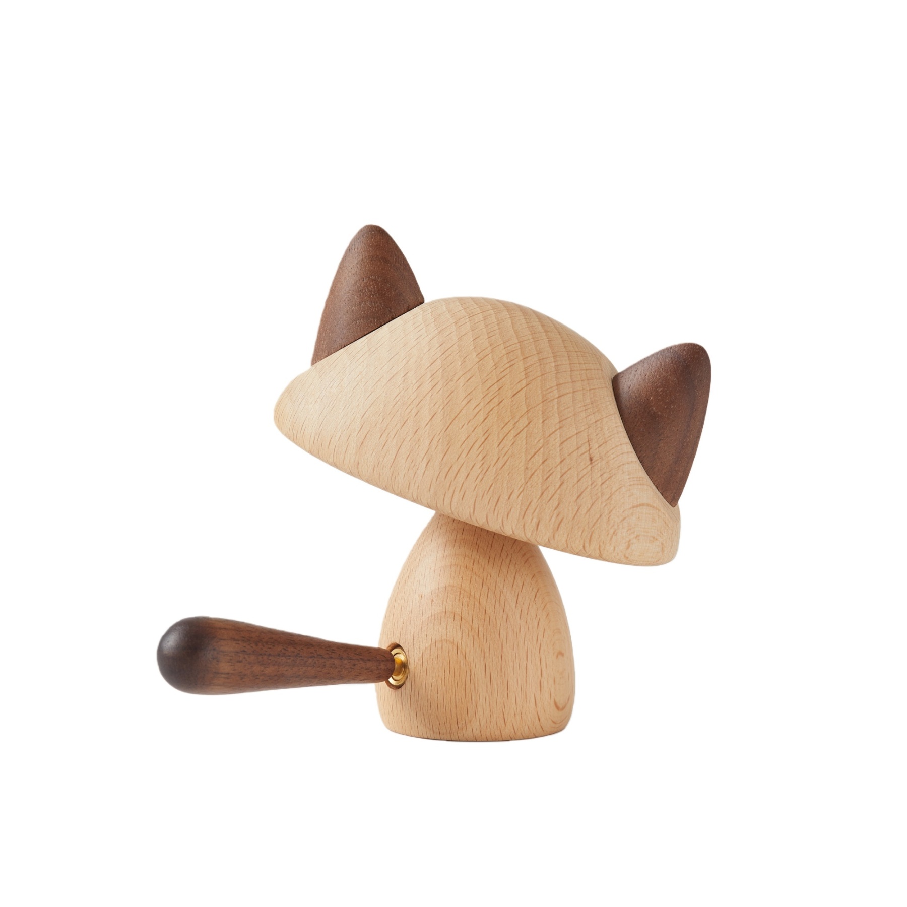 Close-up of handcrafted walnut and beechwood details on warm cat figurine