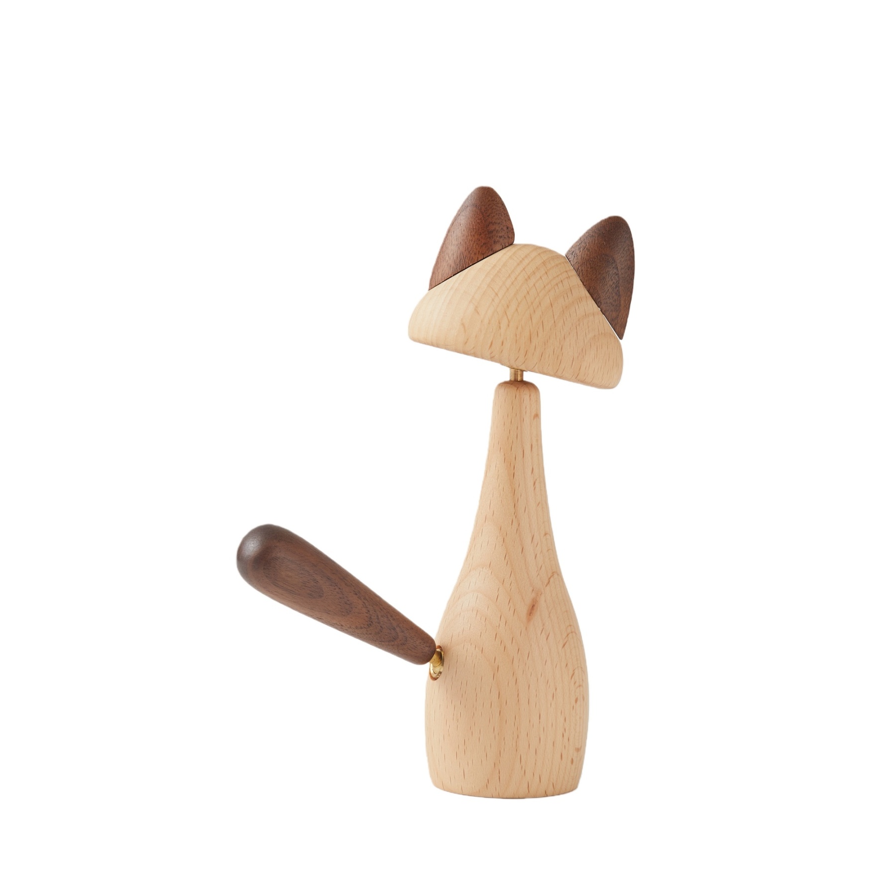 Close-up of handcrafted walnut and beechwood details on warm cat figurine