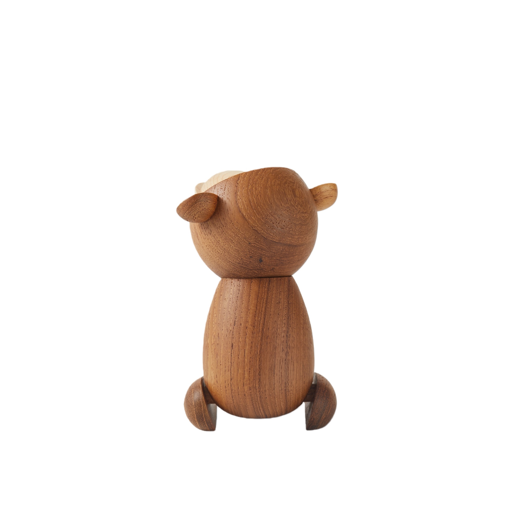 Close-up of handcrafted teak wood texture on Japanese monkey figurine