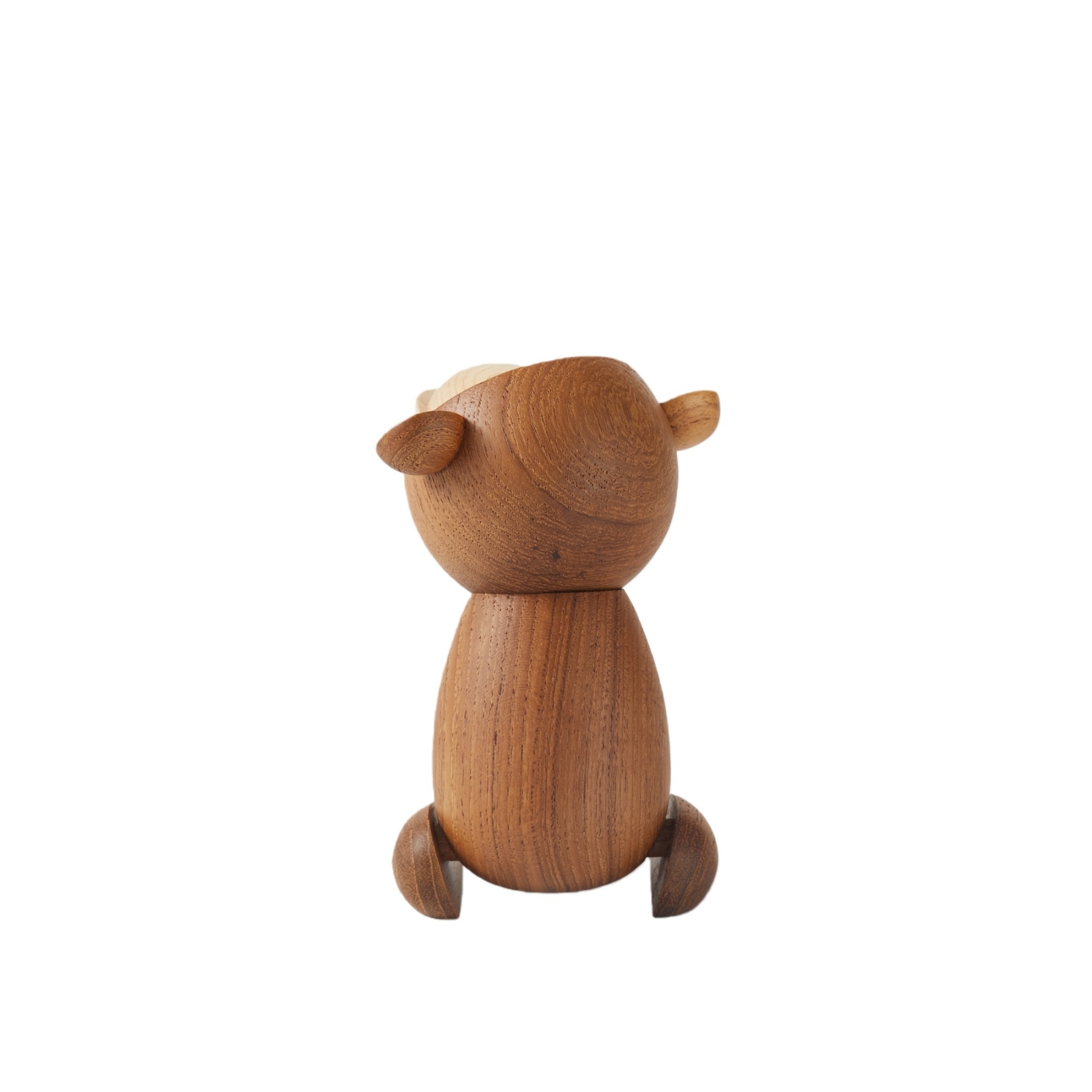 Close-up of handcrafted teak wood texture on Japanese monkey figurine