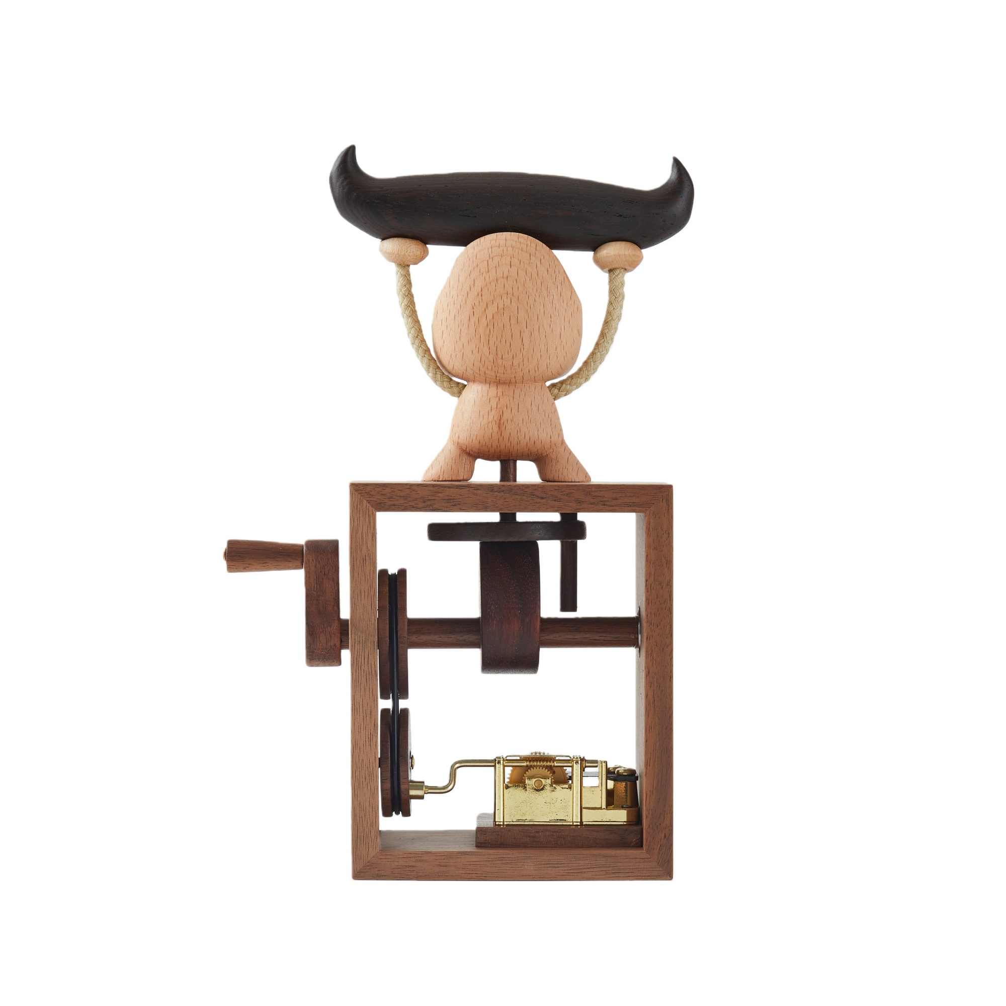 Close-up of handcrafted wood and mechanical details on music box