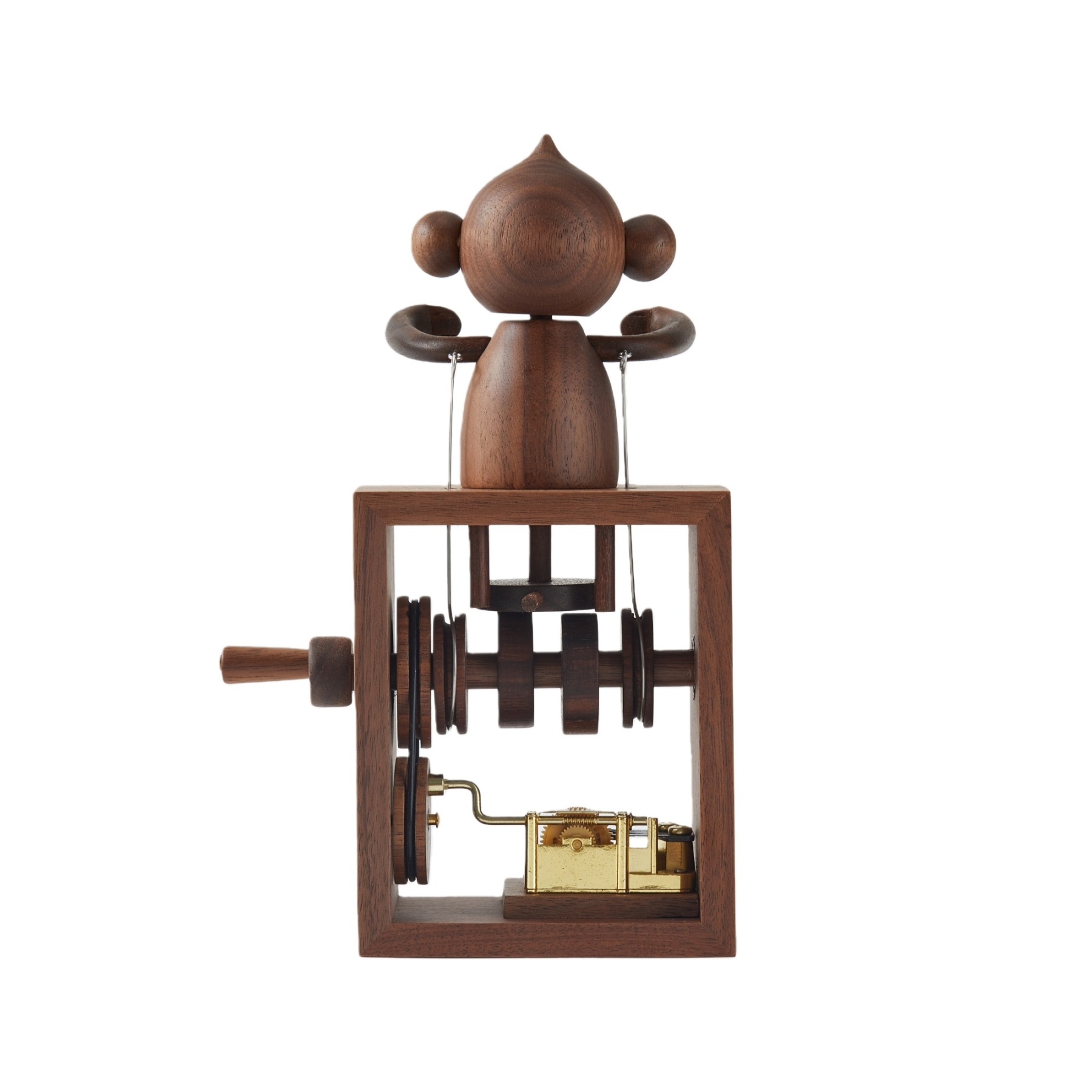 Close-up of handcrafted wooden details on hand crank music box