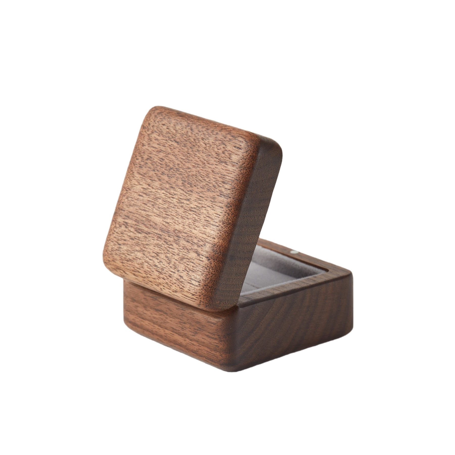 Close-up of handcrafted walnut wood ring box interior