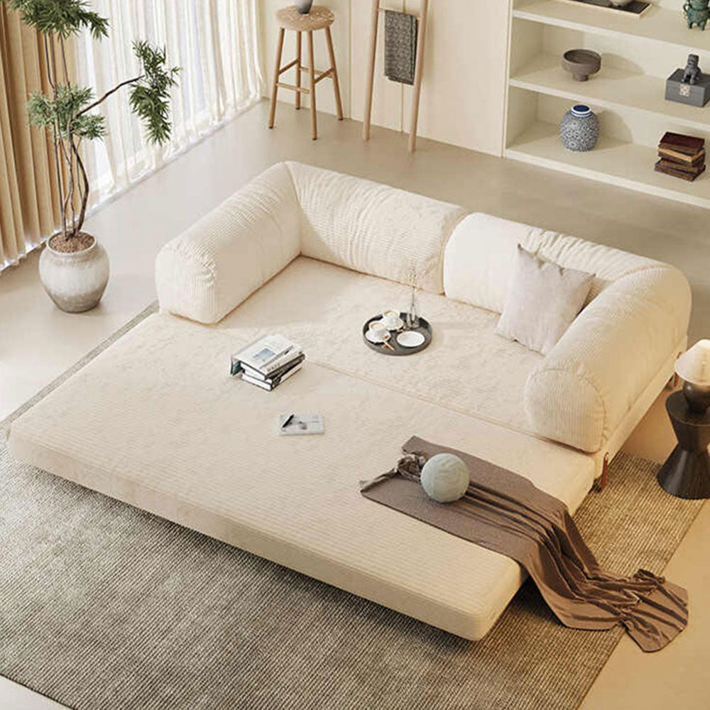 Convertible sofa bed unfolded into a floor-style bed for lounging or sleeping