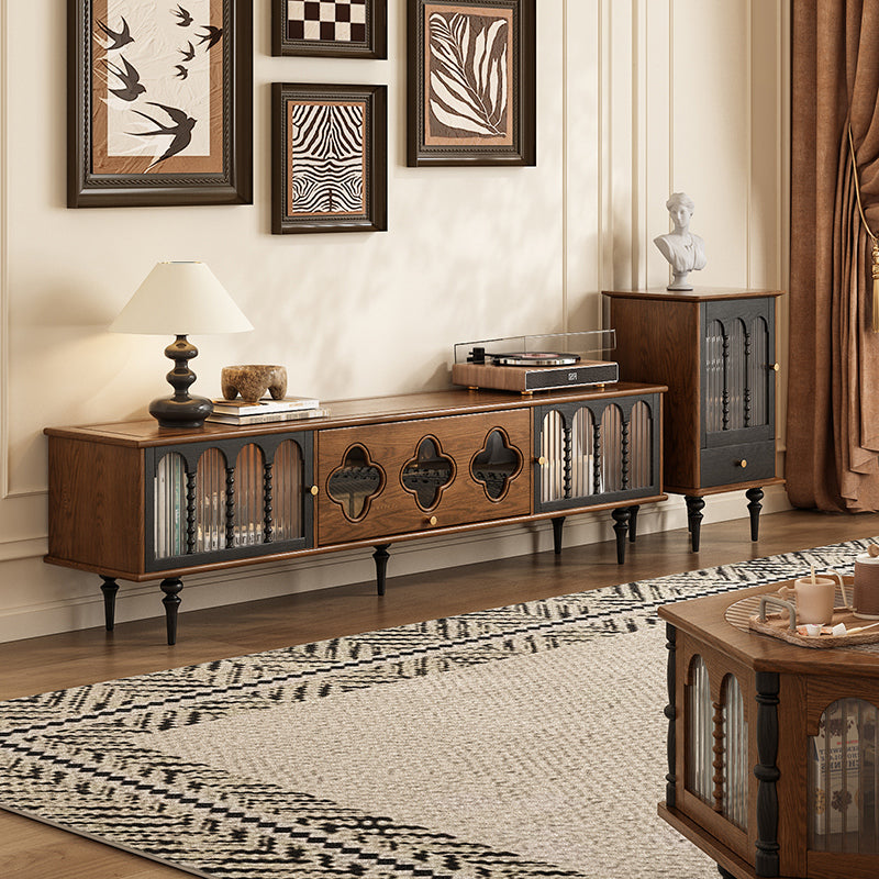 Mid cenrury Tv stand in a living room setting with decorative items and wall art.