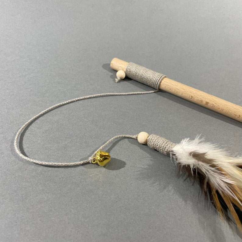 Natural cat teaser toy with feathers and bell