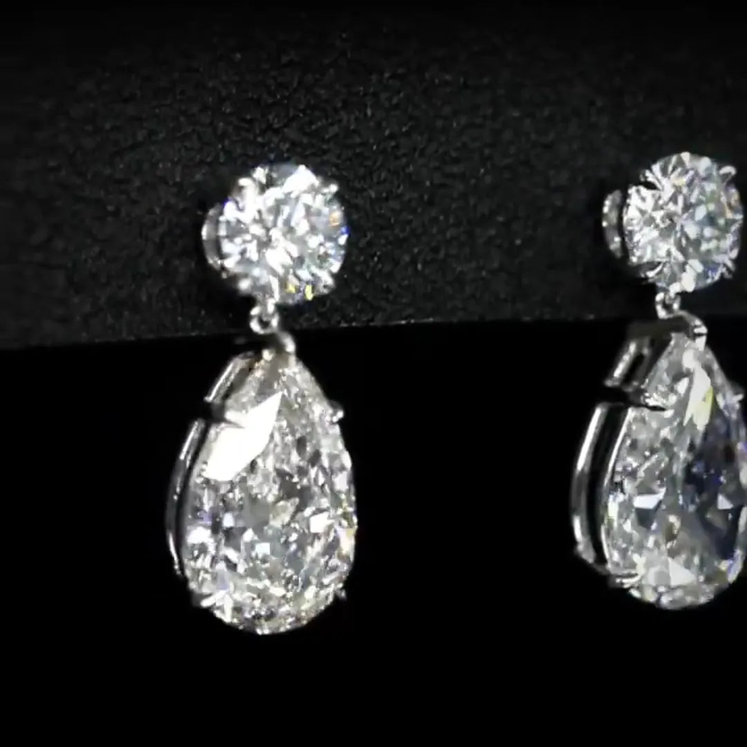 Pear and Round Lab Grown Diamond Earrings (7.80 Ct. Tw.)