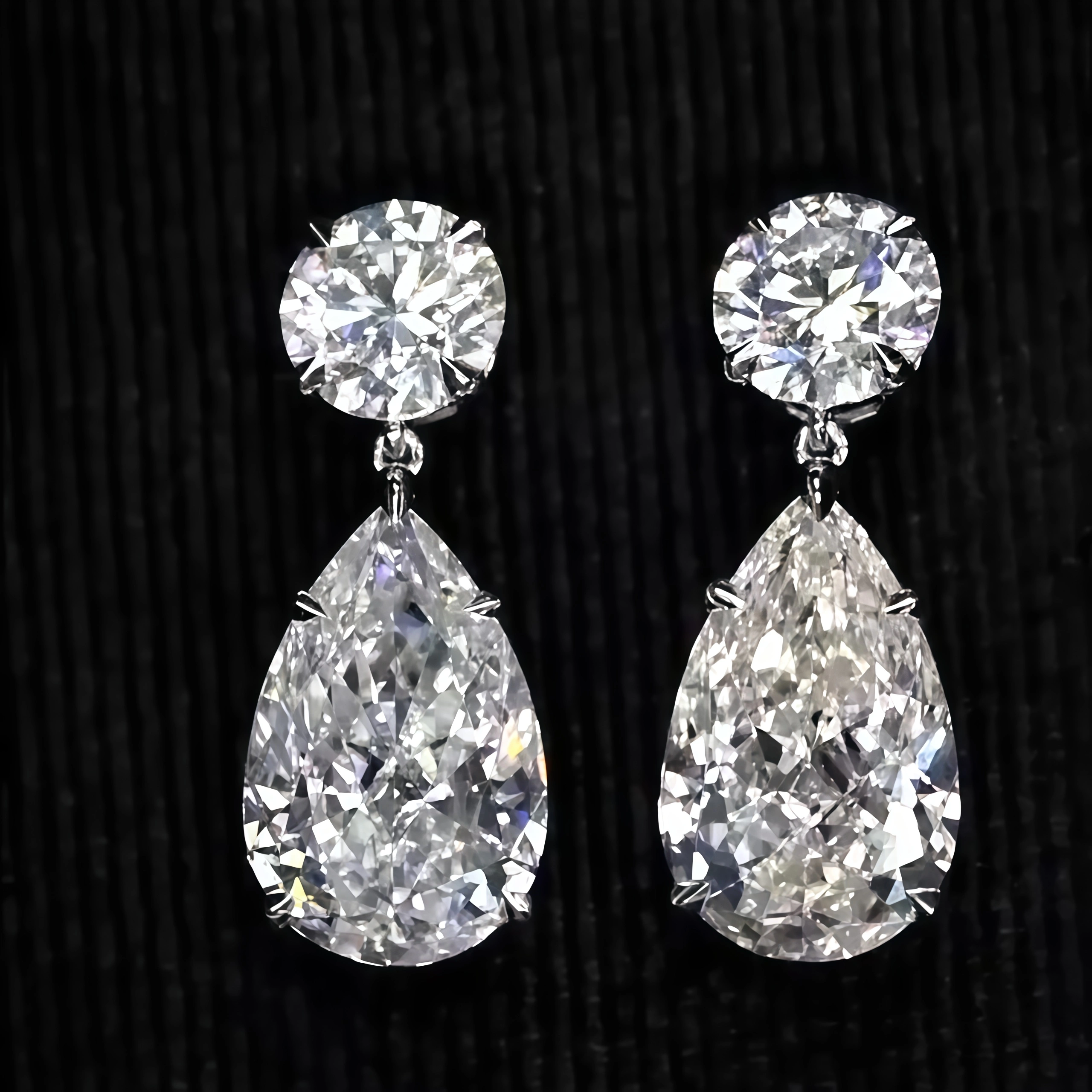 Pear and Round Lab Grown Diamond Earrings (7.80 Ct. Tw.)