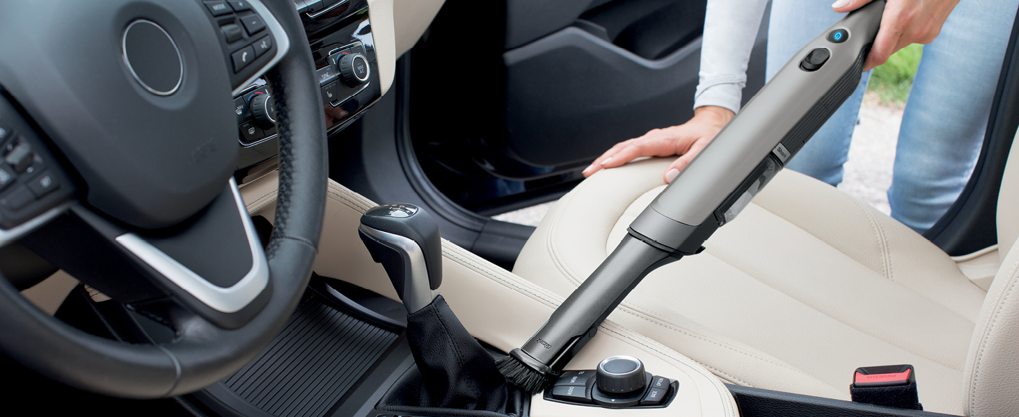 vacuuming up console on car