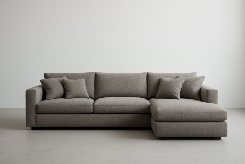 Divano angolare in tessuto di poliestere grigio con cuscini