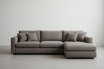 Divano angolare in tessuto di poliestere grigio con cuscini