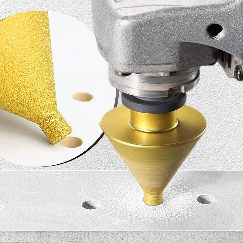 Close-up of a gold conical drill bit attached to a power tool, drilling holes in a white surface. Premium auto tool from clarioy.