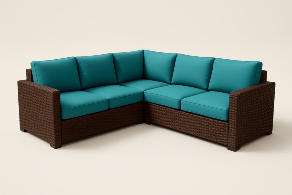 Divano angolare da giardino in rattan con cuscini in tessuto di poliestere