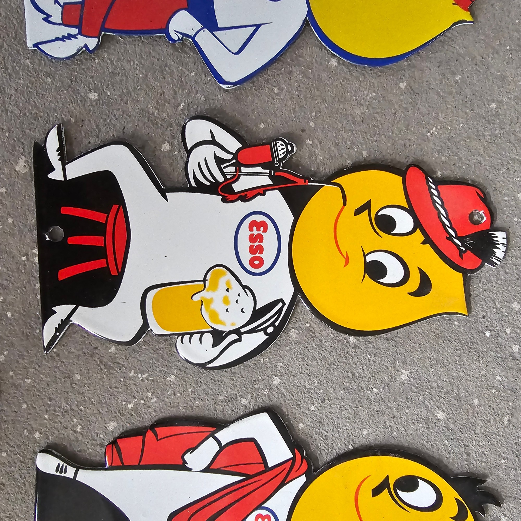 DIE CUT LOTS OF ESSO BOY AND GIRL GAS OIL PORCELAIN SIGN