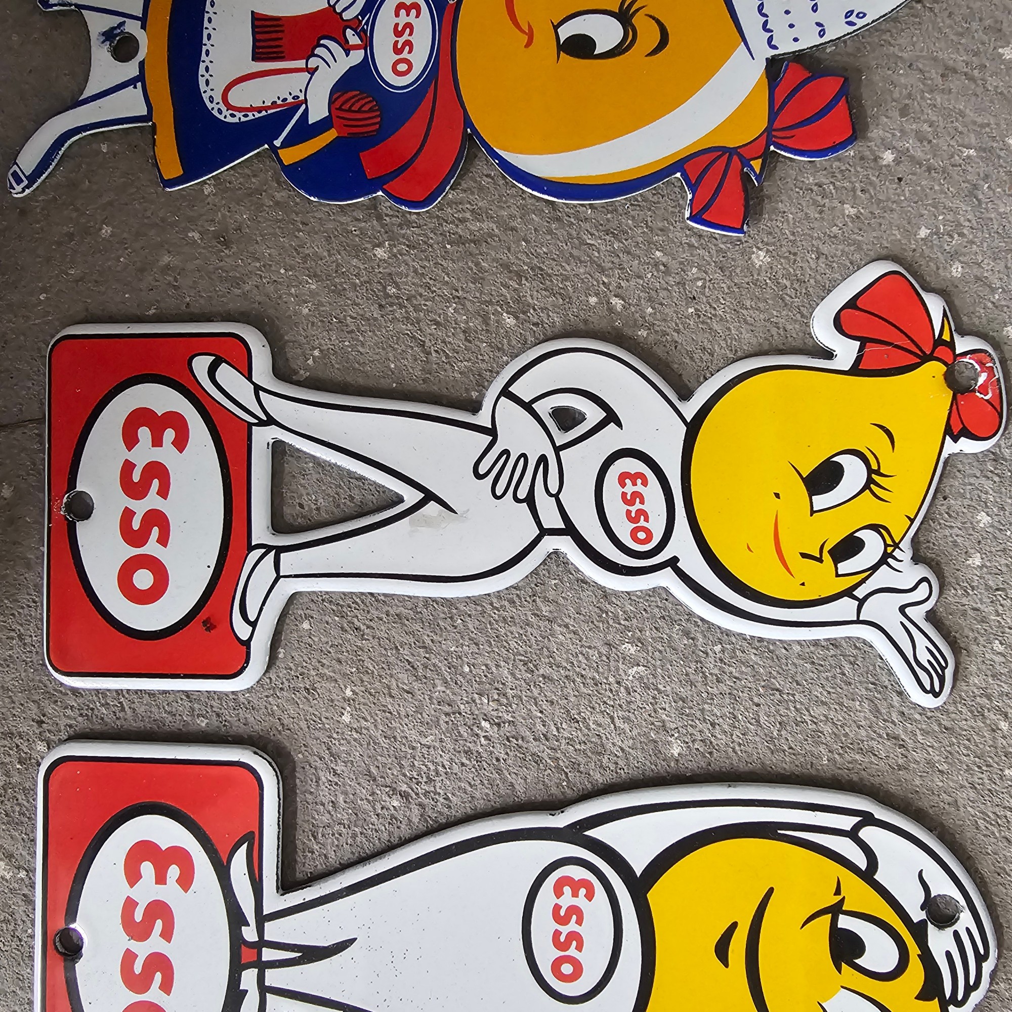 DIE CUT LOTS OF ESSO BOY AND GIRL GAS OIL PORCELAIN SIGN