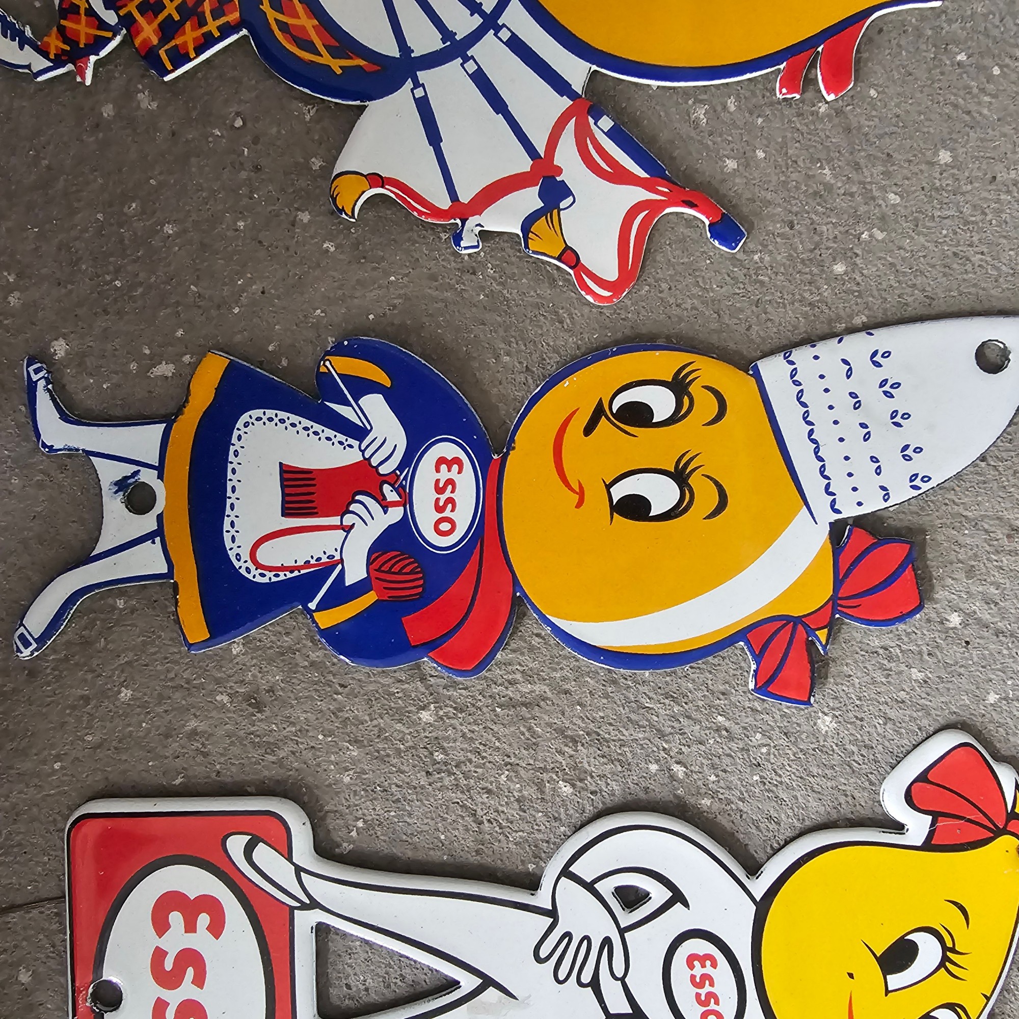DIE CUT LOTS OF ESSO BOY AND GIRL GAS OIL PORCELAIN SIGN