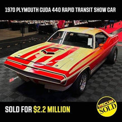 the rare hidden plymouth cuda 440 rapid transit show car on the auction block at mecum on black rubber flooring where it sold for over 2 million