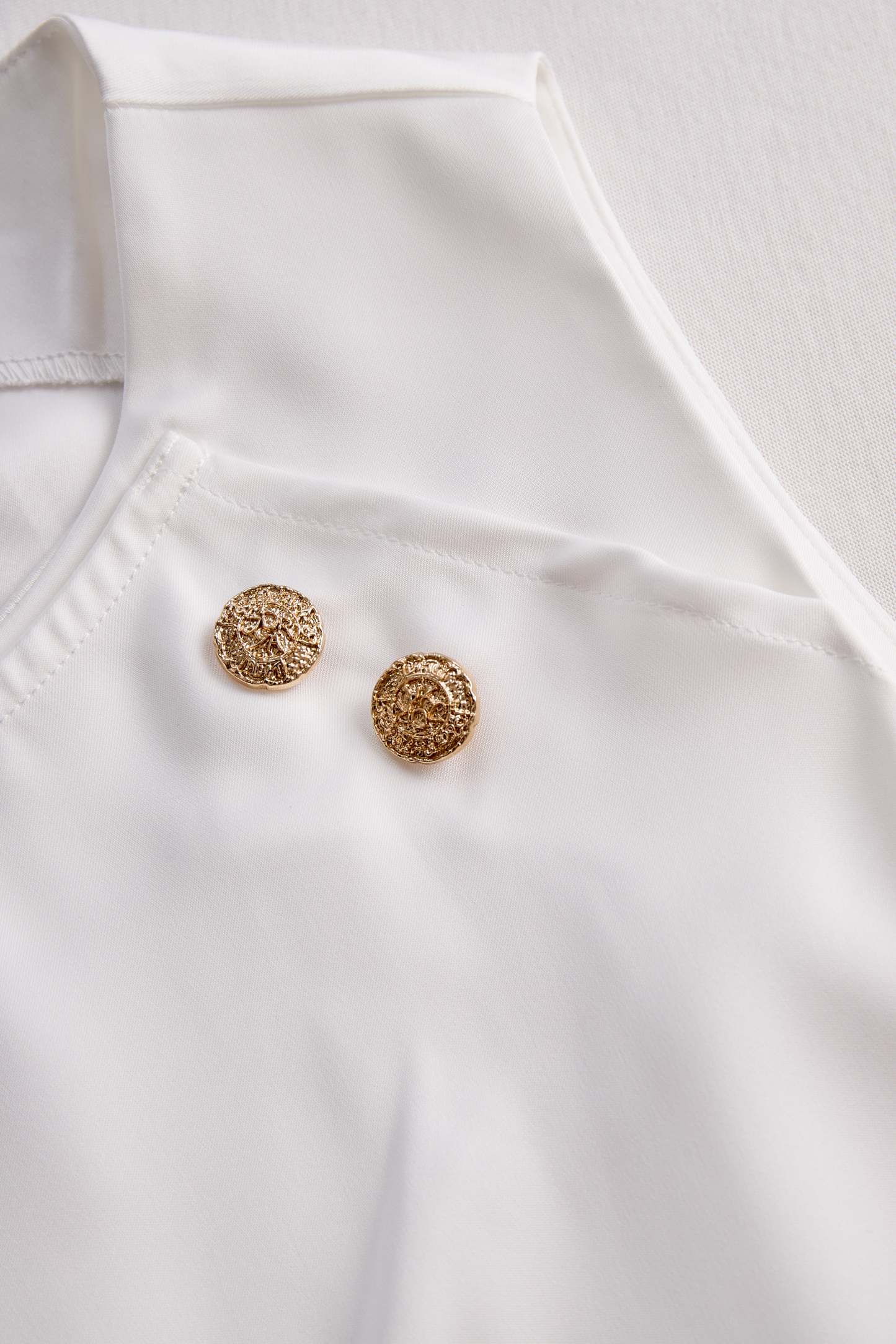 Elegant White Draped Top with Button Detail