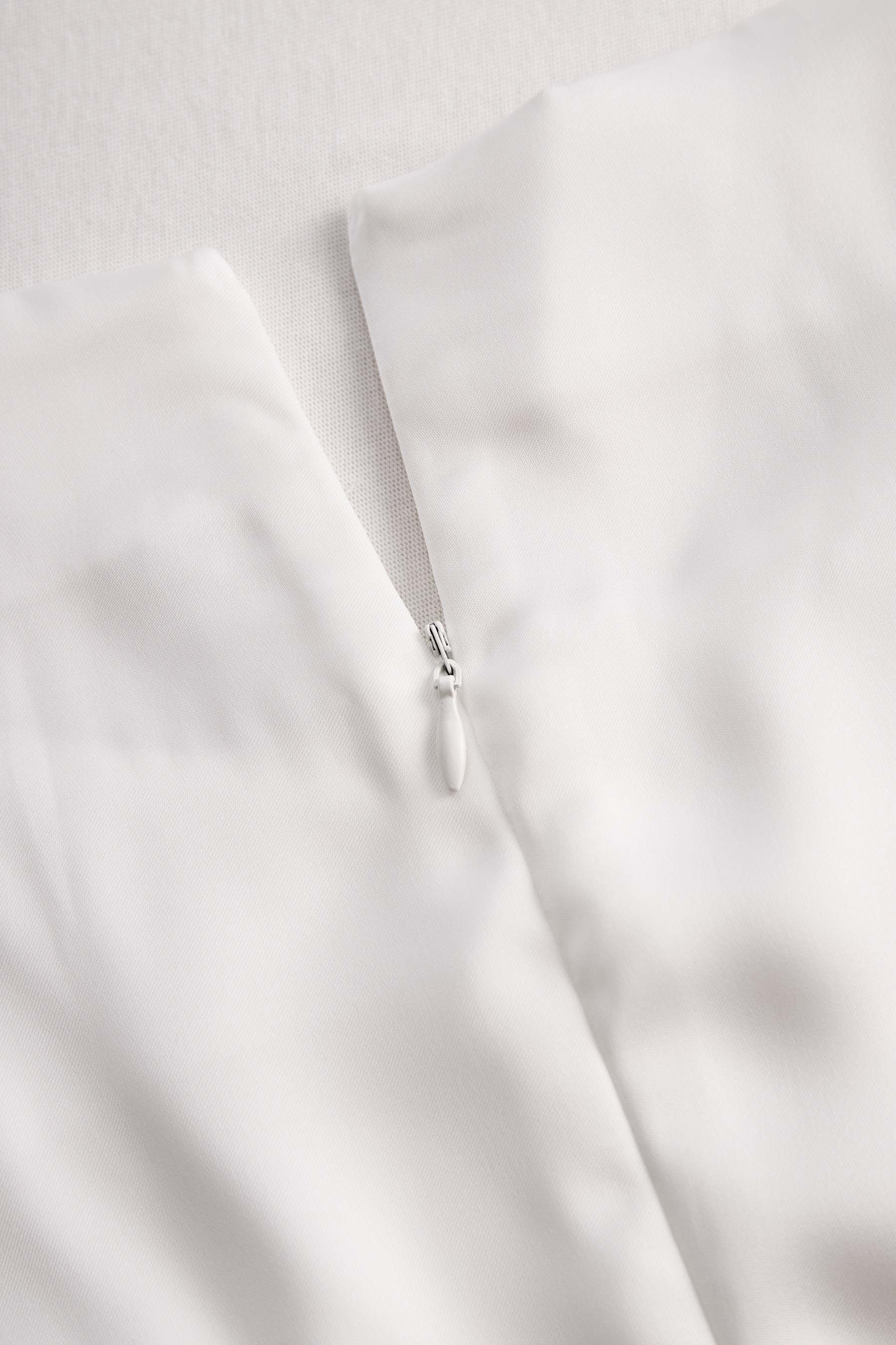 Elegant White Draped Top with Button Detail