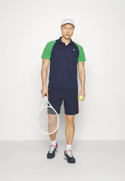 TENNIS - Polo - bleu marine/vert/jaune