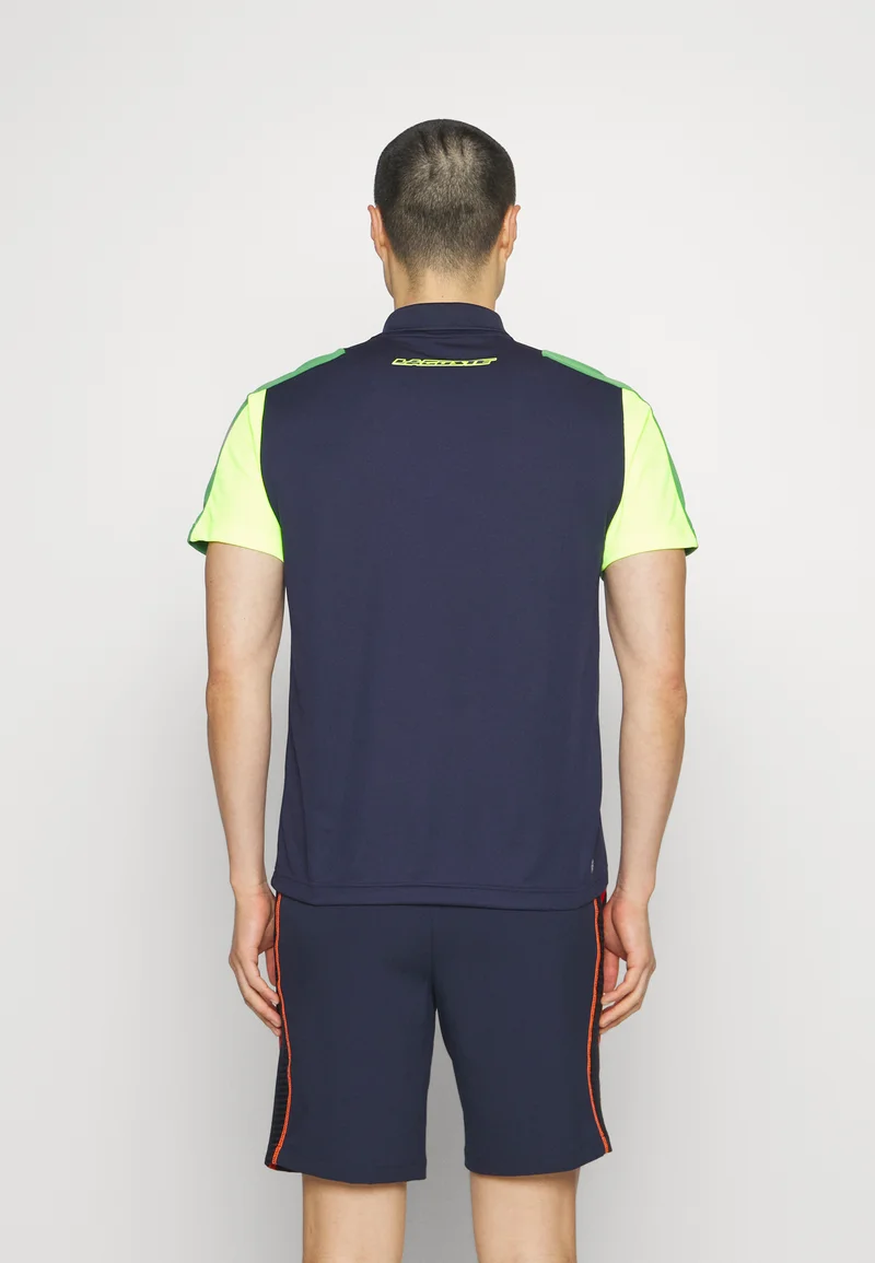 TENNIS - Polo - bleu marine/vert/jaune