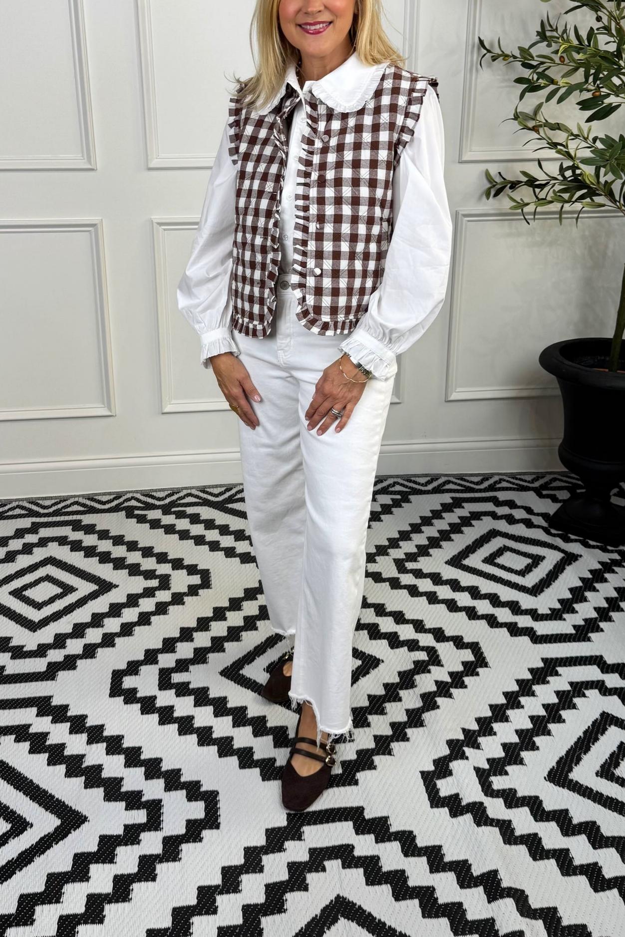 Checked pattern vest with ruffled trim