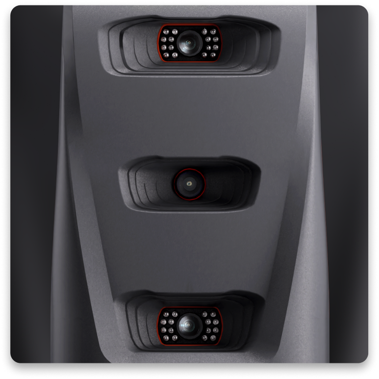 Three camera lenses arranged vertically on a dark gray surface.