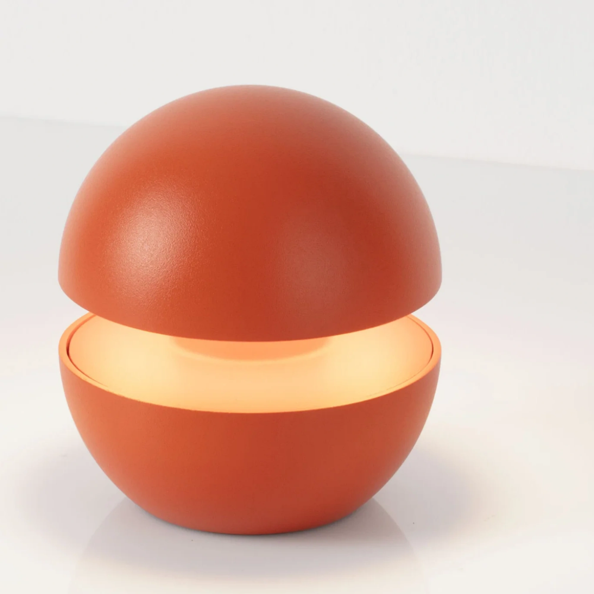 A compact and portable bulb-type desk lamp with adjustable brightness