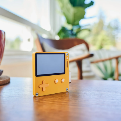 Handheld gaming system - rotatable analog controller