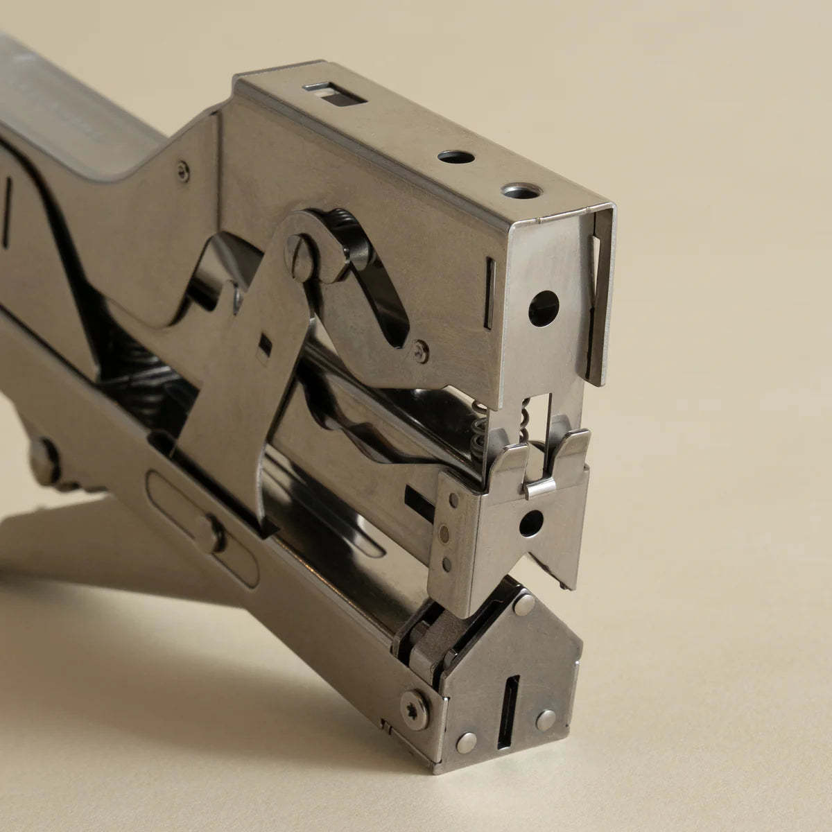 Portable and compact corner nail gun