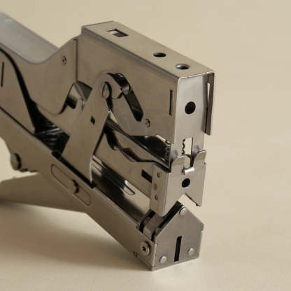 Portable and compact corner nail gun